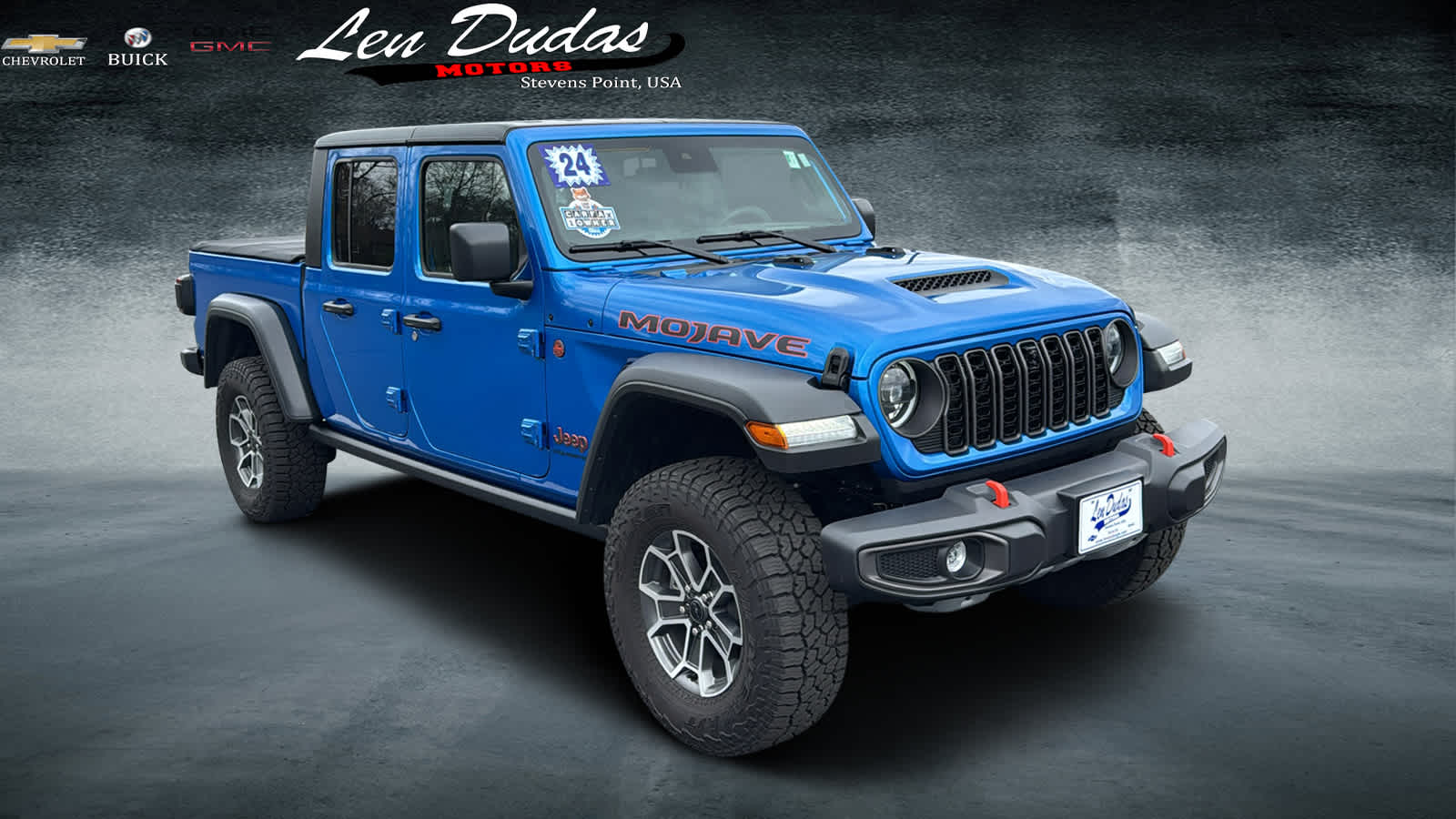 2024 Jeep Gladiator Mojave in Blue — front three-quarter view